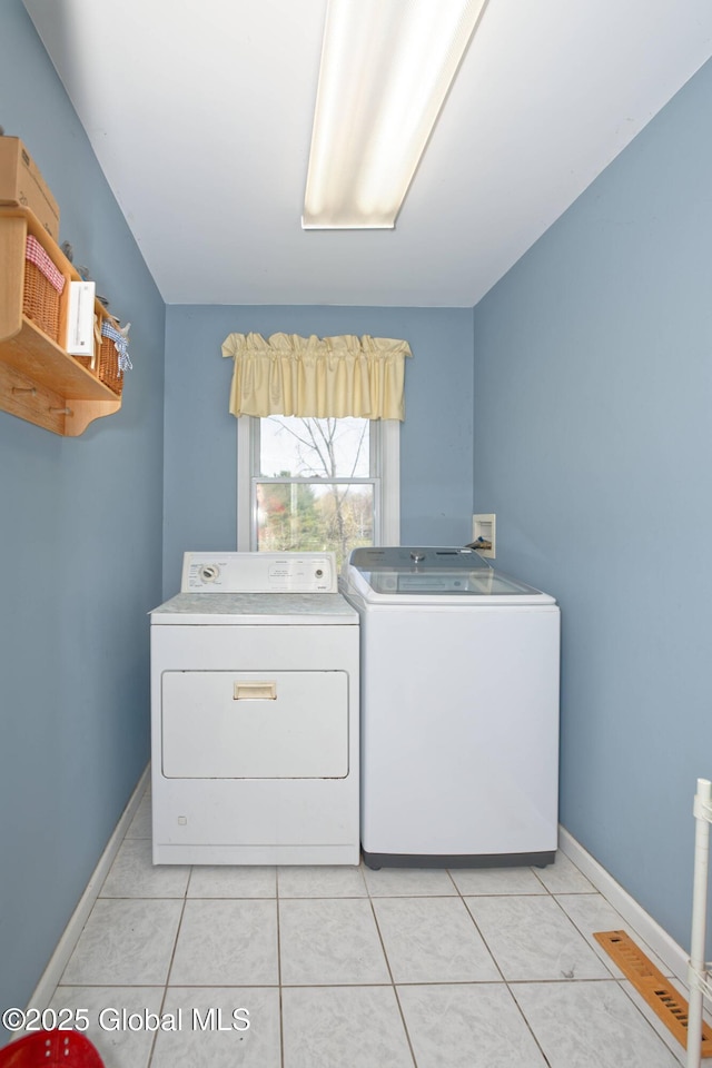 37 Old Hickory Rd, Brunswick, NY 12180 - laundry area with laundry area, washer and clothes dryer, baseboards, and light tile patterned flooring