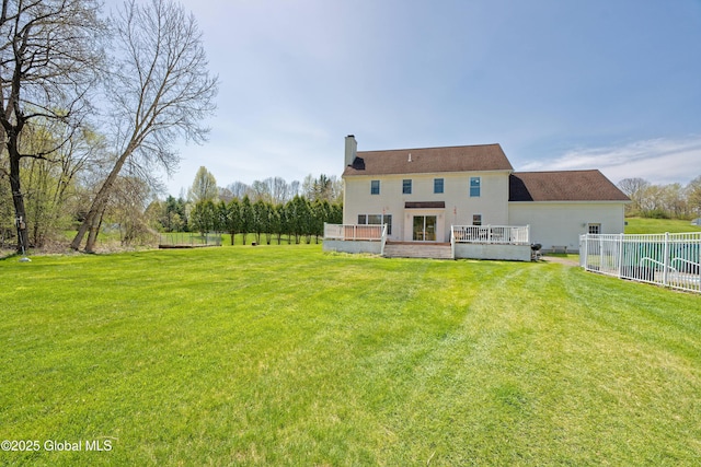 37 Old Hickory Rd, Brunswick, NY 12180 - back of property with a chimney, a deck, fence, and a lawn
