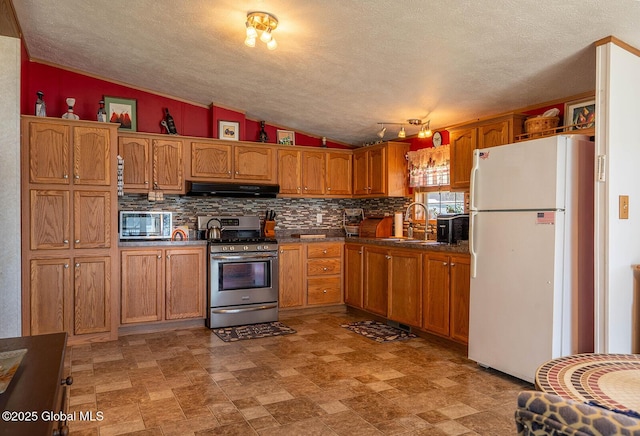 kitchen with a sink, ventilation hood, brown cabinetry, stainless steel appliances, and lofted ceiling