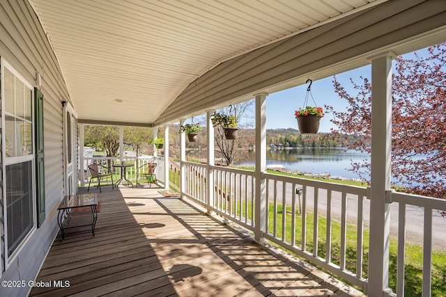 wooden deck featuring a water view