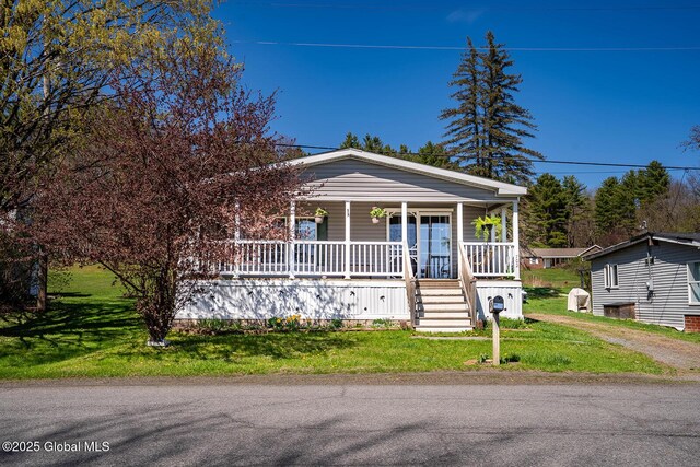 bungalow-style home with covered porch and a front yard