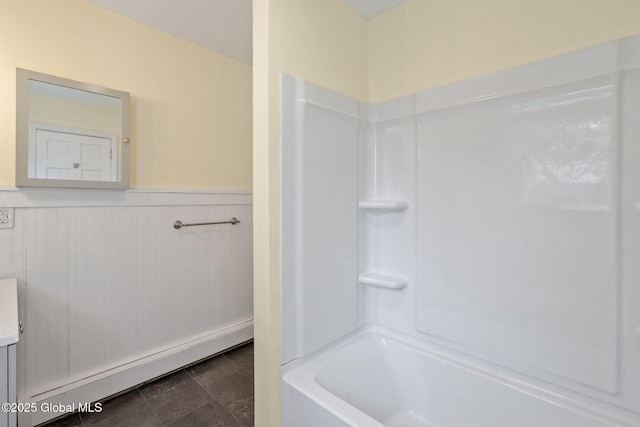 bathroom with vanity, shower / tub combination, a baseboard radiator, and a wainscoted wall