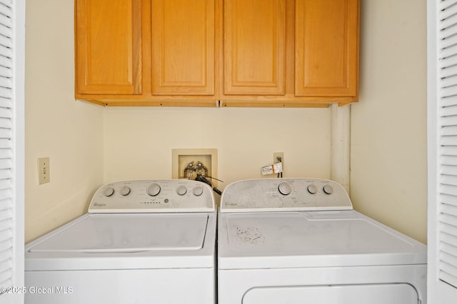 laundry room with washer and dryer and cabinet space