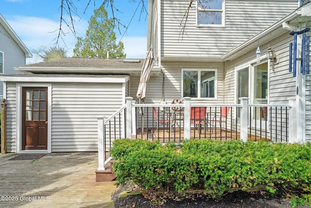 doorway to property with a wooden deck