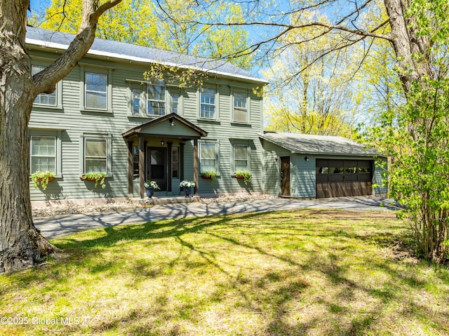 view of front of property with an attached garage and a front yard