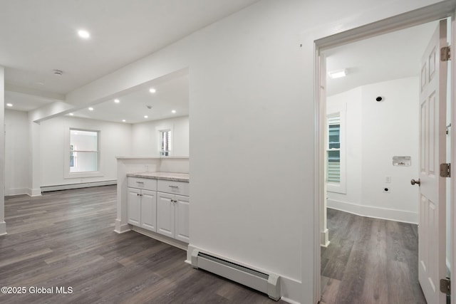 hall featuring recessed lighting, dark wood finished floors, and a baseboard radiator