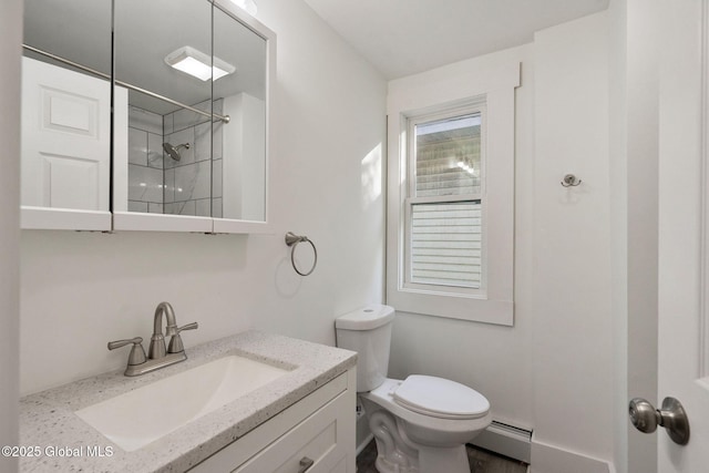 full bath featuring vanity, a baseboard radiator, walk in shower, and toilet