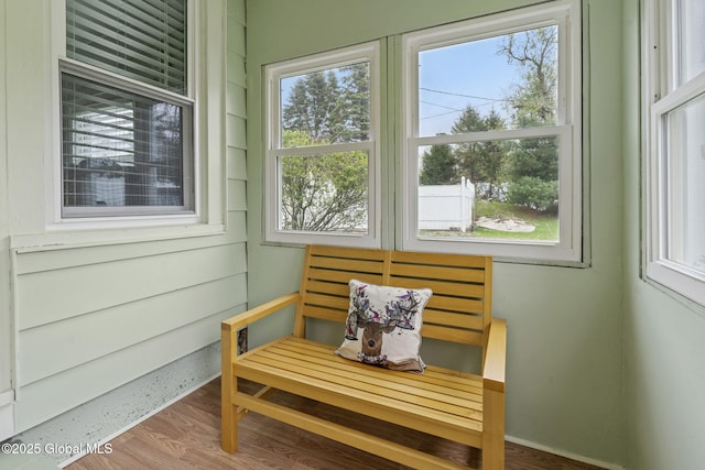 sunroom / solarium featuring a healthy amount of sunlight