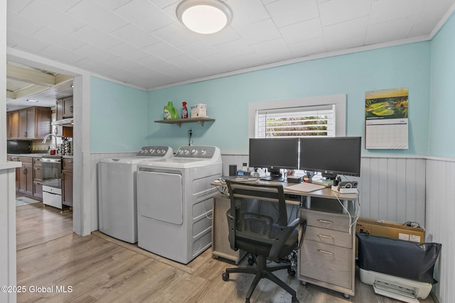 office with crown molding, wainscoting, independent washer and dryer, and light wood finished floors