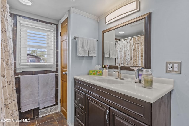 full bathroom featuring crown molding, vanity, tile patterned floors, and visible vents