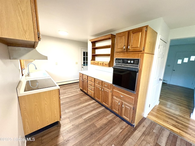 11 Mcdermott Rd, Mechanicville, NY 12118 - kitchen with oven, a sink, baseboard heating, light wood finished floors, and open shelves