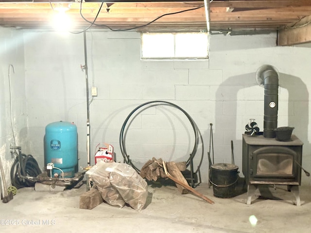11 Mcdermott Rd, Mechanicville, NY 12118 - below grade area featuring a water pressure tank and a wood stove