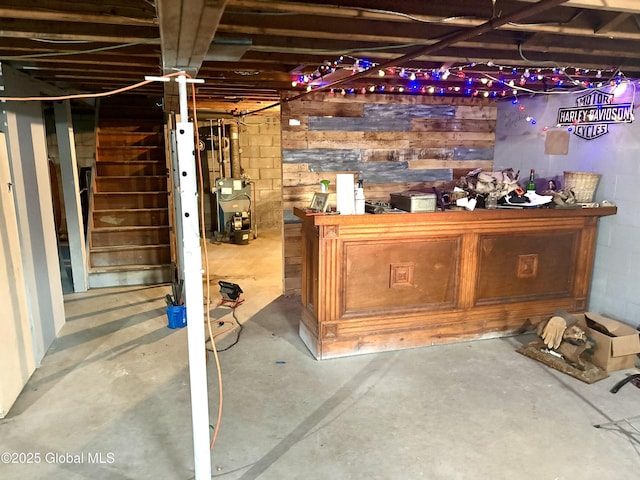 11 Mcdermott Rd, Mechanicville, NY 12118 - indoor dry bar featuring concrete floors, a heating unit, and stairway