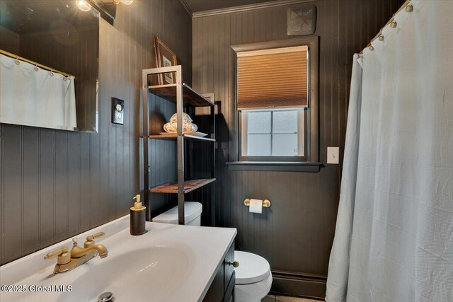 bathroom with toilet, a baseboard radiator, vanity, crown molding, and a shower with curtain