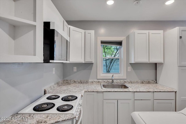 kitchen featuring a sink, white electric range, white cabinets, recessed lighting, and light stone counters