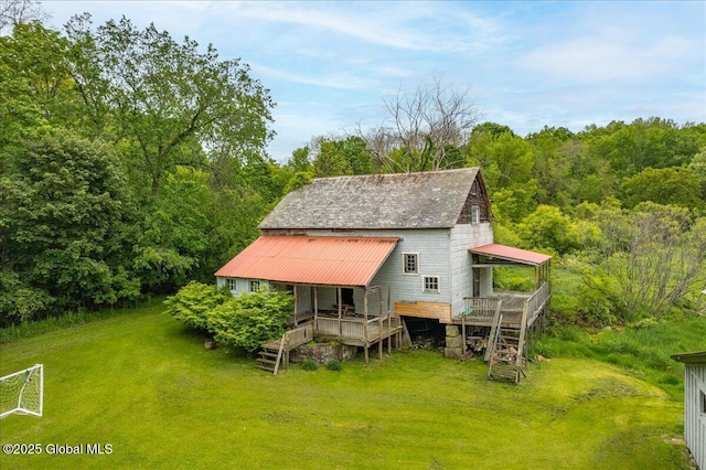 291-294 Gilchrist Hill Rd, Hartford, NY 12838 - back of property featuring stairway, a view of trees, a yard, and a wooden deck