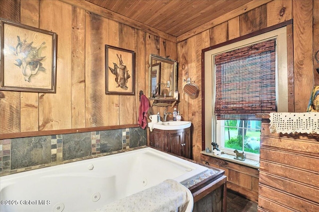 291-294 Gilchrist Hill Rd, Hartford, NY 12838 - full bathroom featuring wooden walls, wooden ceiling, a whirlpool tub, and vanity