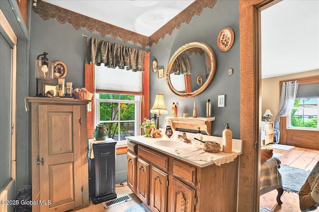 291-294 Gilchrist Hill Rd, Hartford, NY 12838 - ensuite bathroom featuring wood finished floors and vanity