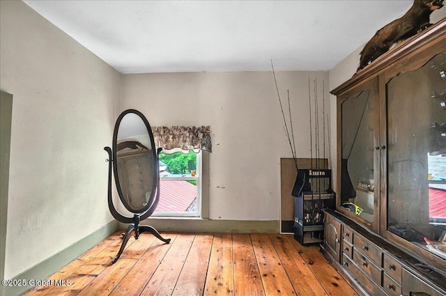 291-294 Gilchrist Hill Rd, Hartford, NY 12838 - empty room featuring hardwood / wood-style flooring, healthy amount of natural light, and baseboards