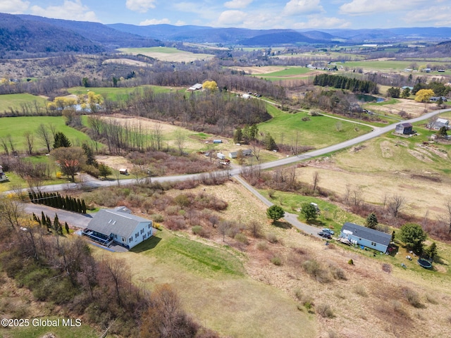 bird's eye view featuring a mountain view and a rural view