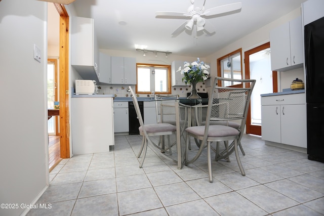 dining room featuring light tile patterned floors and ceiling fan