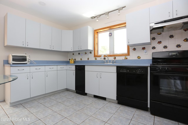 kitchen featuring decorative backsplash, white cabinetry, under cabinet range hood, and black appliances