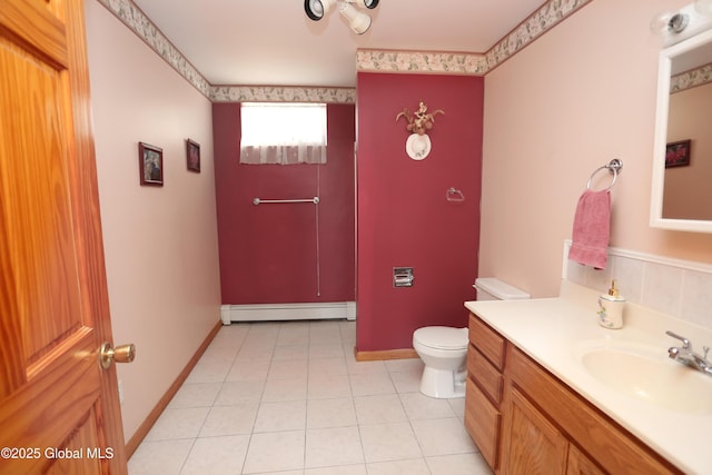 bathroom featuring tile patterned flooring, a baseboard radiator, vanity, and toilet