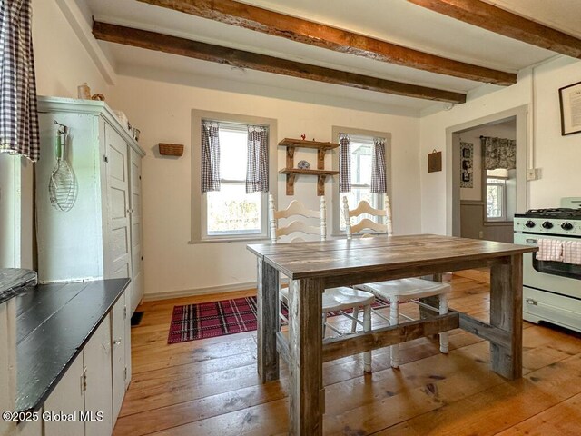 11 Mill St, Chester, NY 12817 - dining space featuring baseboards, beam ceiling, and light wood-style floors