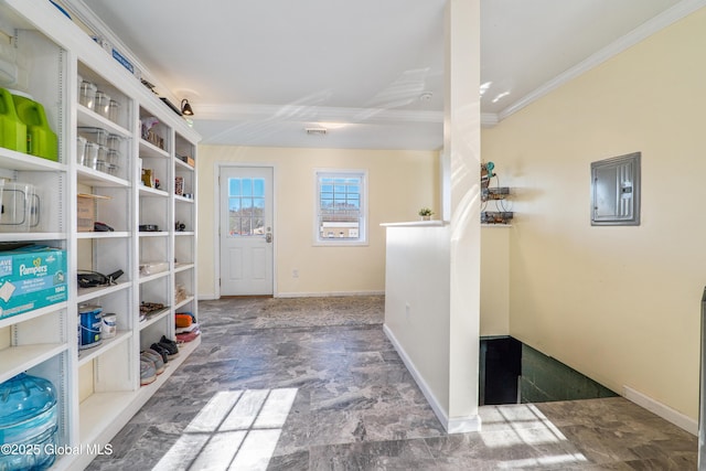 interior space featuring crown molding, baseboards, stone finish flooring, and electric panel