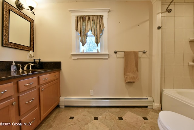 bathroom with toilet,  shower combination, a baseboard heating unit, and vanity