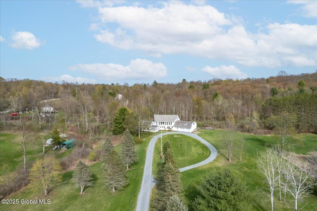 drone / aerial view with a view of trees