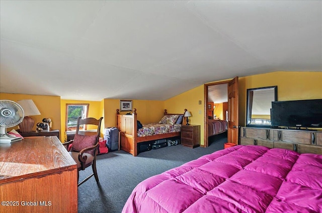 bedroom featuring carpet flooring and vaulted ceiling
