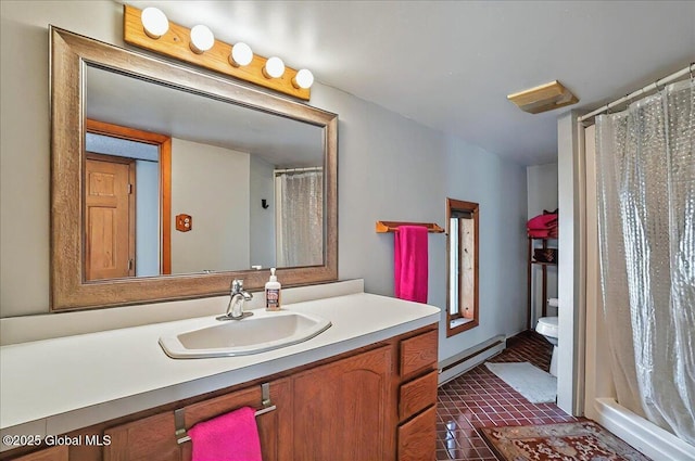 full bath featuring vanity, toilet, baseboard heating, tile patterned floors, and a shower with curtain