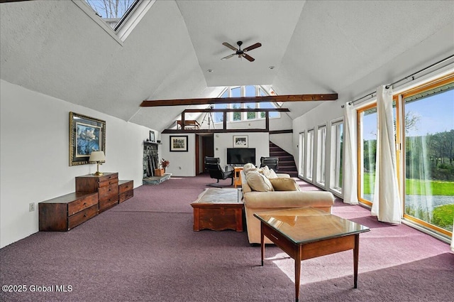 living area with carpet floors, a ceiling fan, a healthy amount of sunlight, and stairway