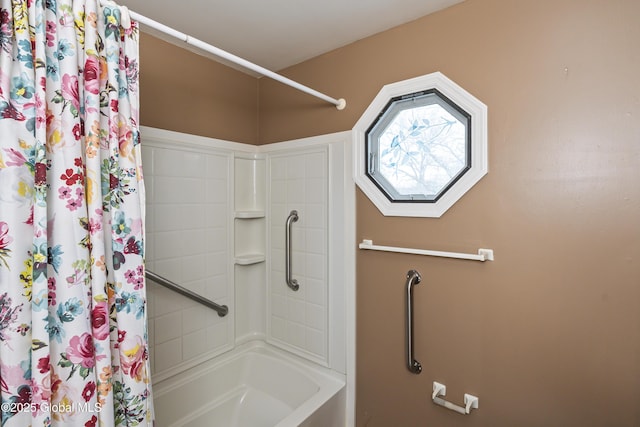bathroom with shower / bath combination with curtain