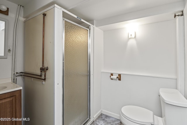 full bath featuring vanity, a stall shower, and toilet