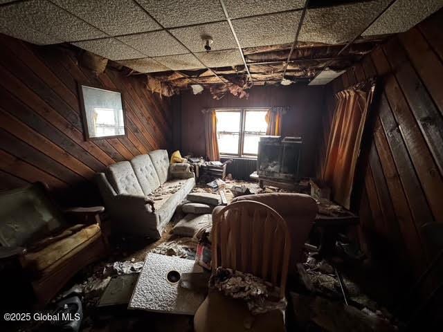 miscellaneous room featuring wooden walls