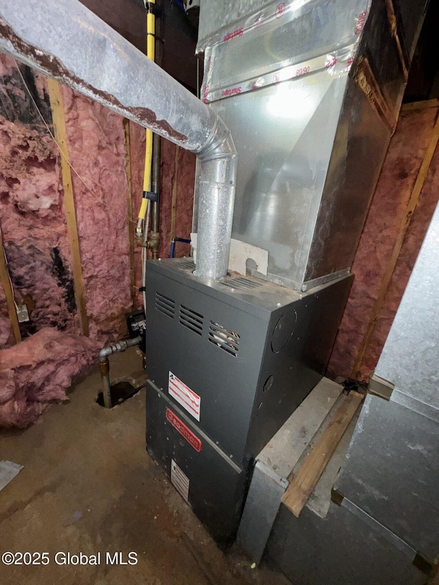 utility room with heating unit