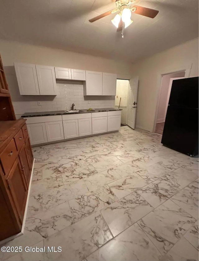 28 Pulaski St, Amsterdam, NY 12010 - kitchen featuring a sink, marble finish floor, and ceiling fan