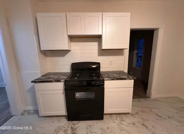 28 Pulaski St, Amsterdam, NY 12010 - kitchen with decorative backsplash, marble finish floor, baseboards, white cabinetry, and black range with gas cooktop