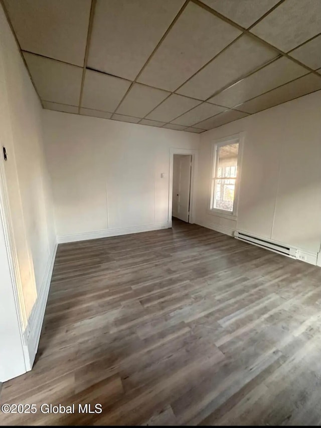 28 Pulaski St, Amsterdam, NY 12010 - unfurnished room with wood finished floors, baseboards, and a drop ceiling