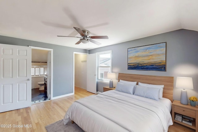 bedroom featuring baseboards, ceiling fan, multiple windows, and wood finished floors