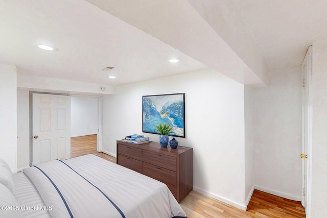 bedroom featuring recessed lighting, baseboards, light wood-type flooring, and visible vents