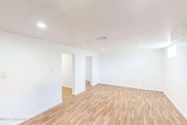 empty room with visible vents, recessed lighting, light wood finished floors, and baseboards