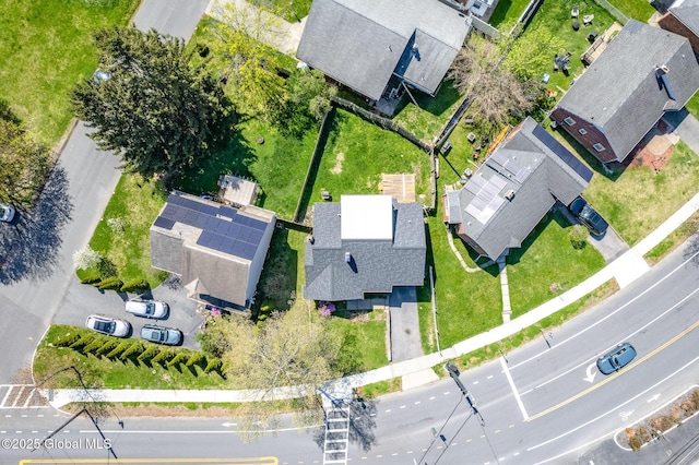 birds eye view of property with a residential view