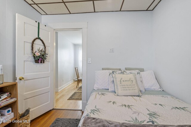 bedroom with wood finished floors