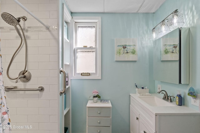 full bath featuring a shower with shower curtain and vanity
