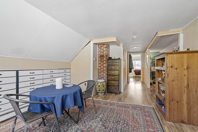 interior space with lofted ceiling and wood finished floors