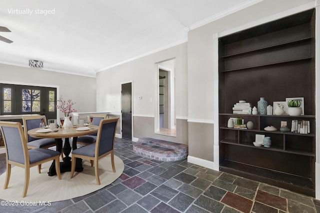 27 Aaron Dr, Catskill, NY 12414 - dining area featuring stone tile floors, crown molding, baseboards, built in shelves, and a ceiling fan