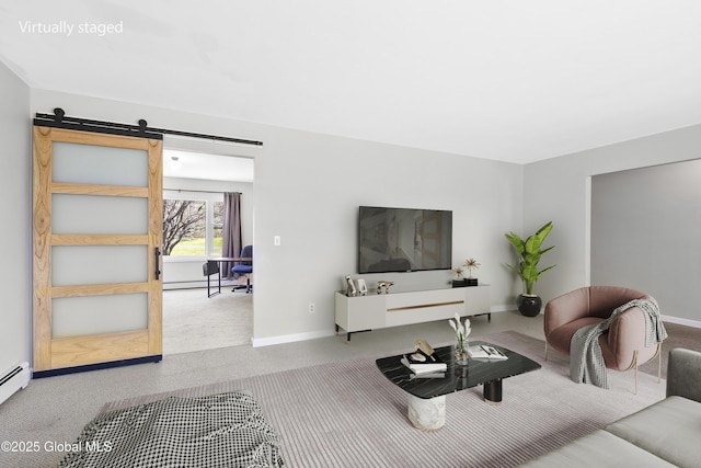 27 Aaron Dr, Catskill, NY 12414 - living room with carpet, baseboards, a barn door, and a baseboard radiator
